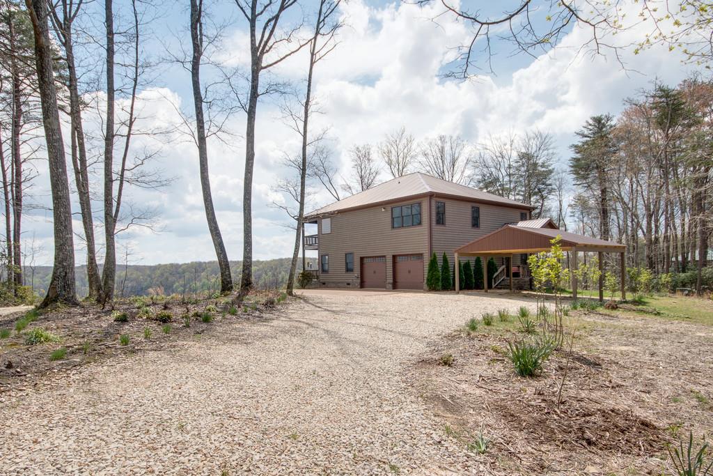55 Cooley's Rift Boulevard Monteagle, TN 37356 - Photo 23 of 30 a big house with large trees and wooden fence