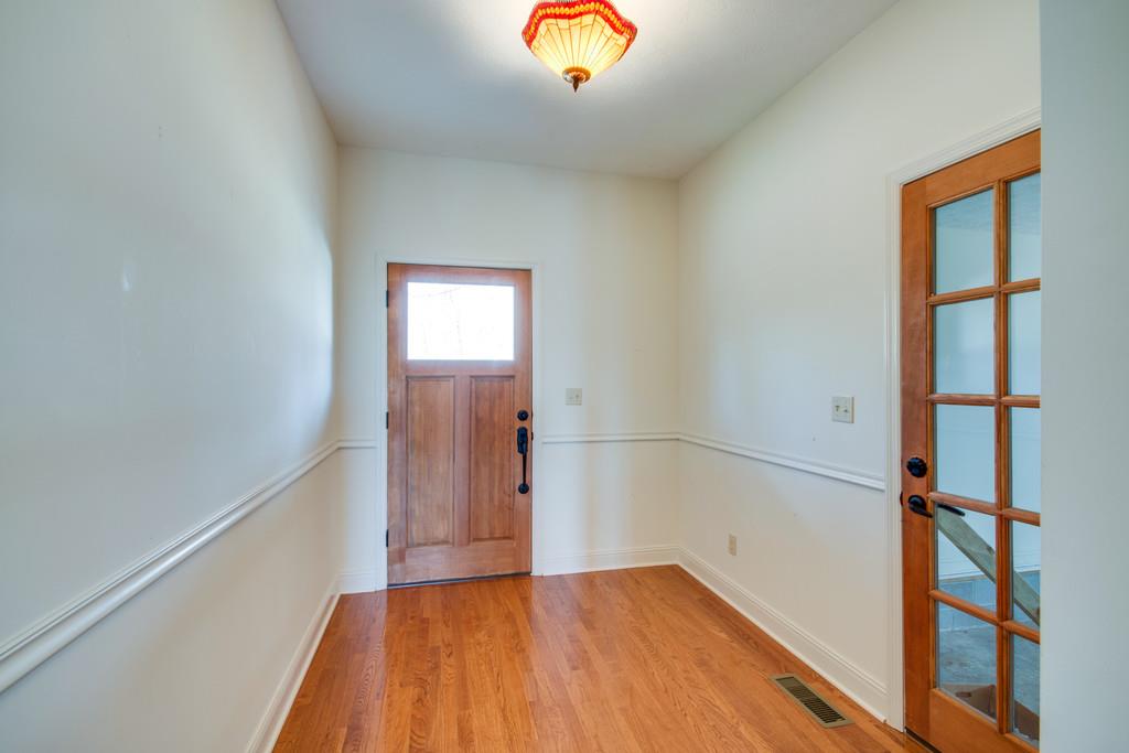 55 Cooley's Rift Boulevard Monteagle, TN 37356 - Photo 3 of 30 a view of an empty room with wooden floor and a window