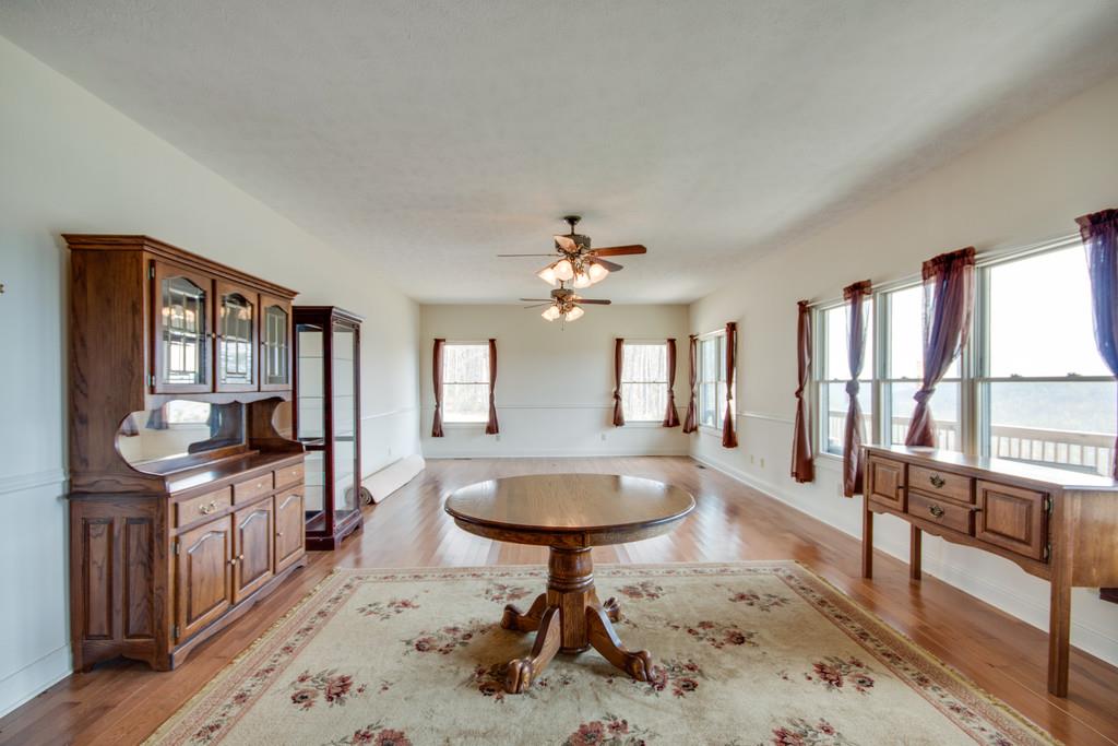 55 Cooley's Rift Boulevard Monteagle, TN 37356 - Photo 8 of 30 a living room with large furniture and a chandelier