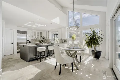 a very nice looking dining room with a table and chairs