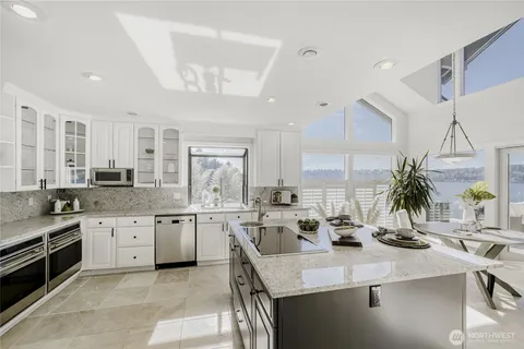 a kitchen with sink stove and cabinets
