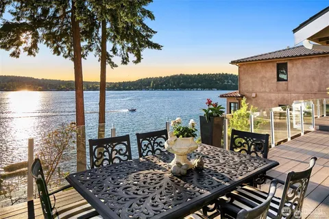 a view of a roof deck with furniture
