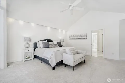a spacious bedroom with a bed and closet