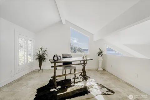 a work room with furniture and a window
