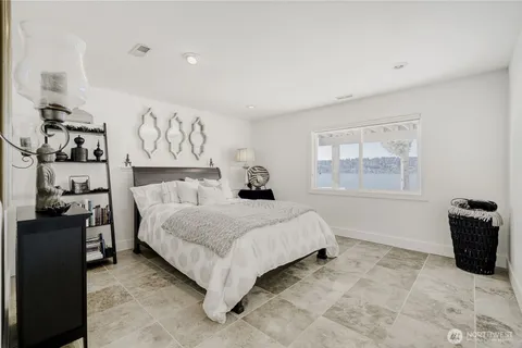 a bedroom with a bed and dresser