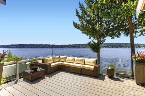 a view of a couches on the deck with wooden floor