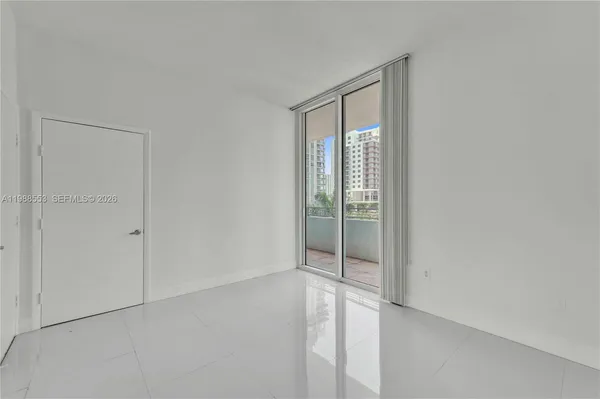 an empty room with sliding door