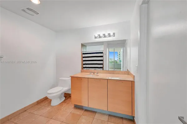 a view of bathroom with a sink and toilet