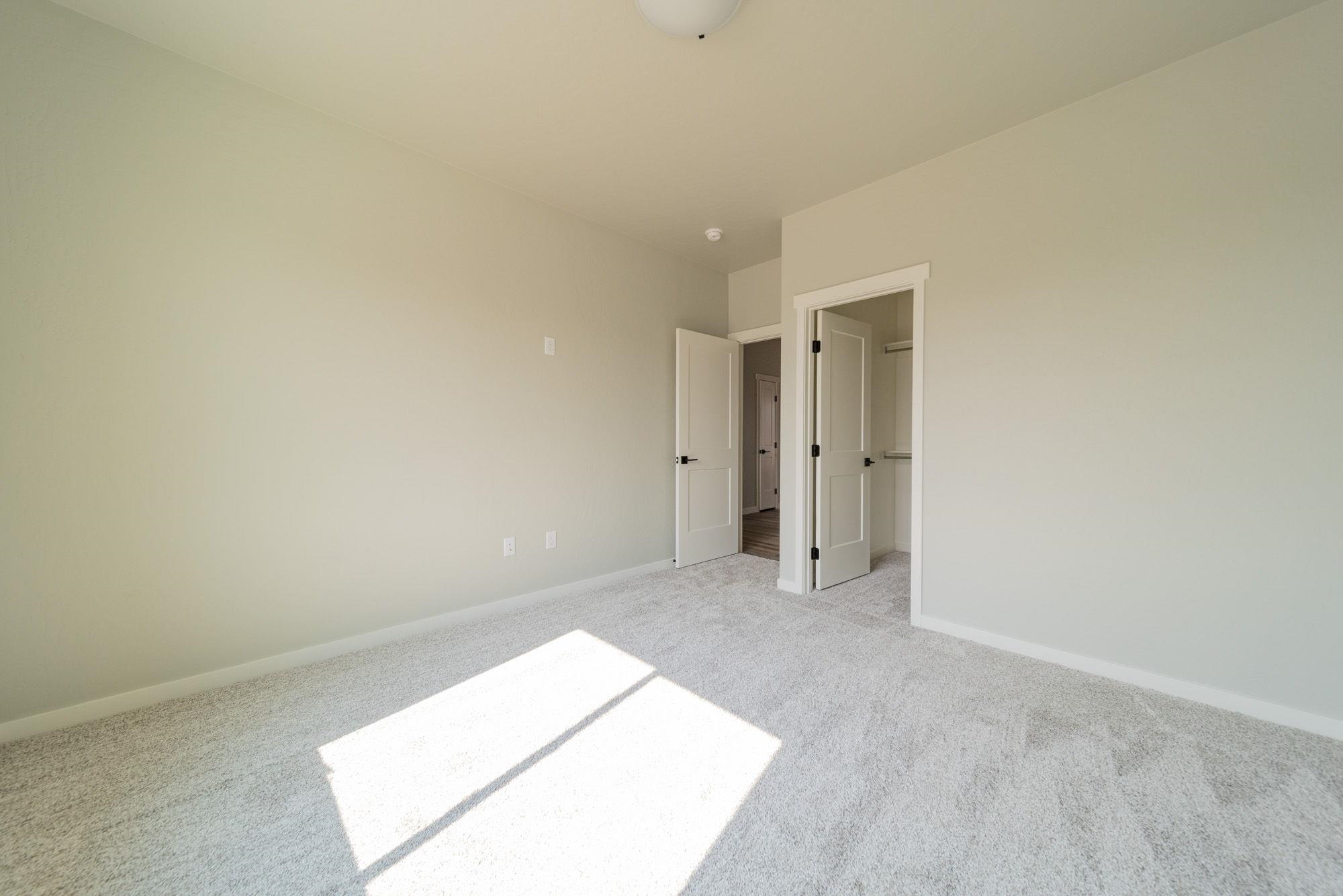 1614 Tungsten Way Fruita, CO 81521 - Photo 14 of 16 an empty room with an entryway