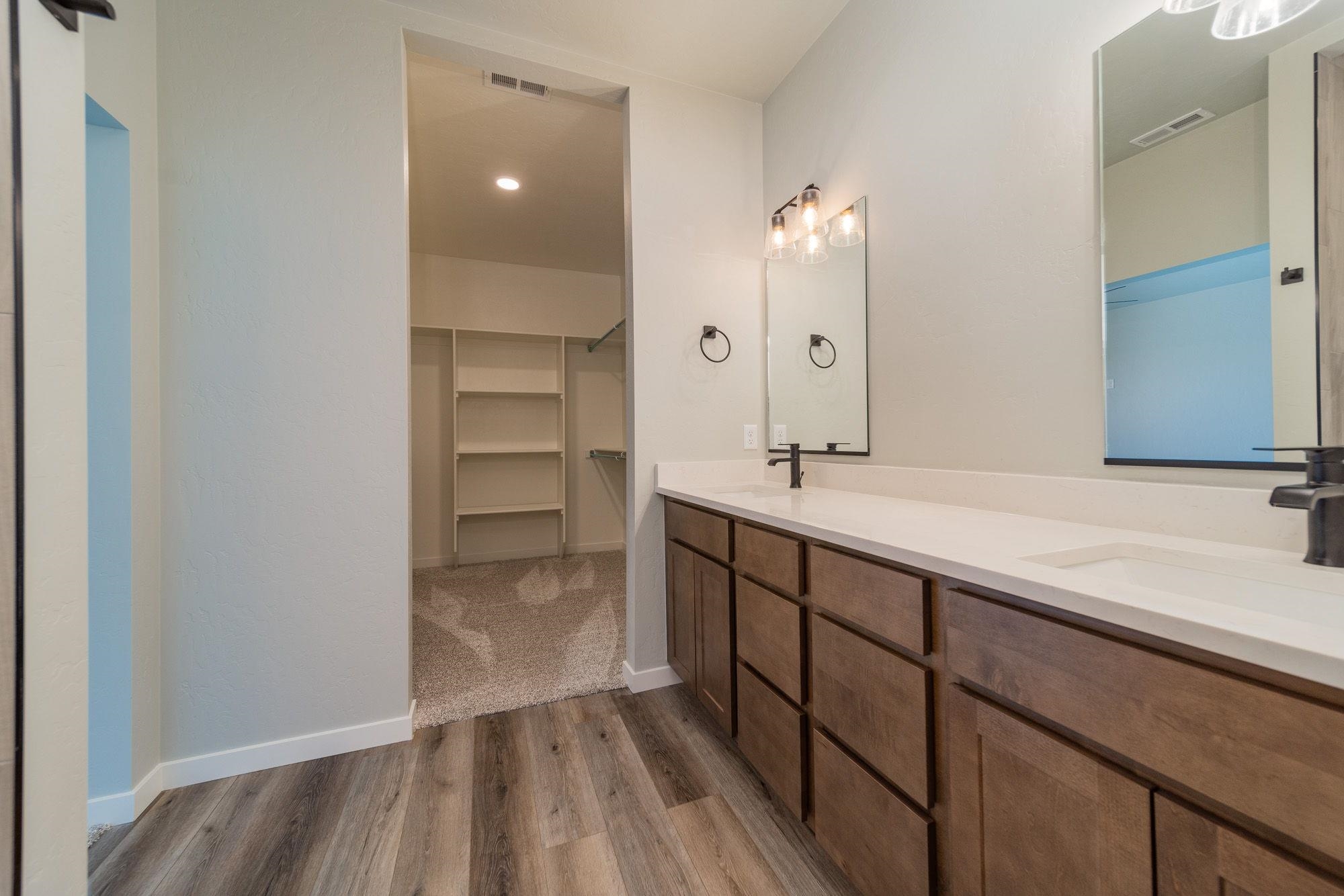 1614 Tungsten Way Fruita, CO 81521 - Photo 3 of 16 a bathroom with a sink and a mirror