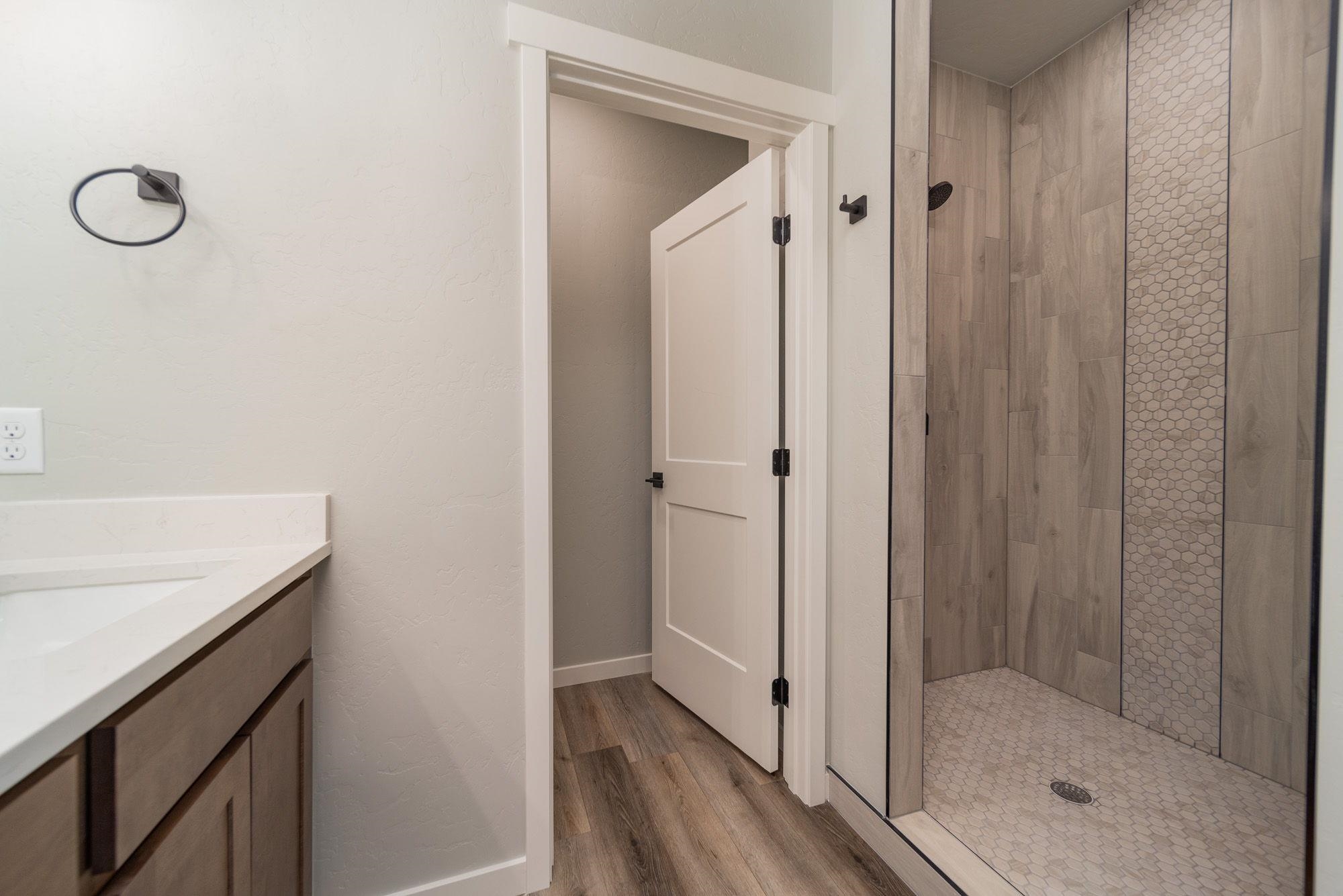 1614 Tungsten Way Fruita, CO 81521 - Photo 4 of 16 a bathroom with a shower and a sink