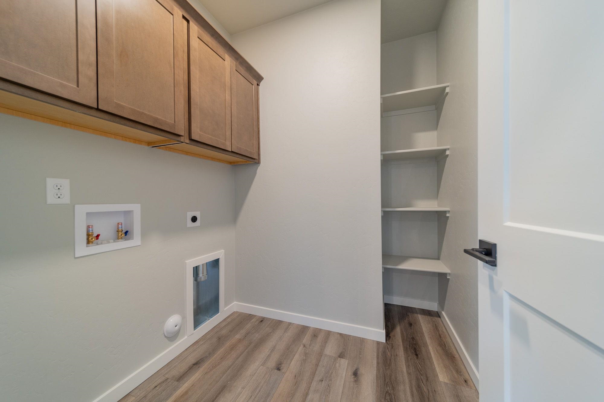 1614 Tungsten Way Fruita, CO 81521 - Photo 5 of 16 a view of storage and utility room with washer and dryer