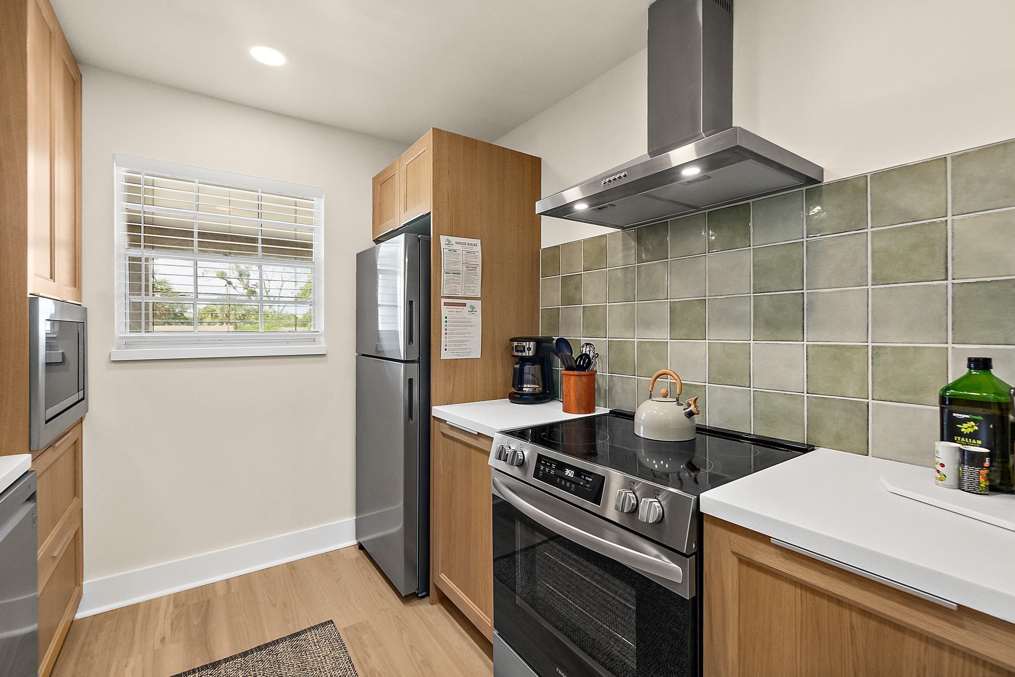 405 Flagler Boulevard, Unit 8A St. Augustine, FL 32080 - Photo 14 of 35 a kitchen with a stove and a refrigerator