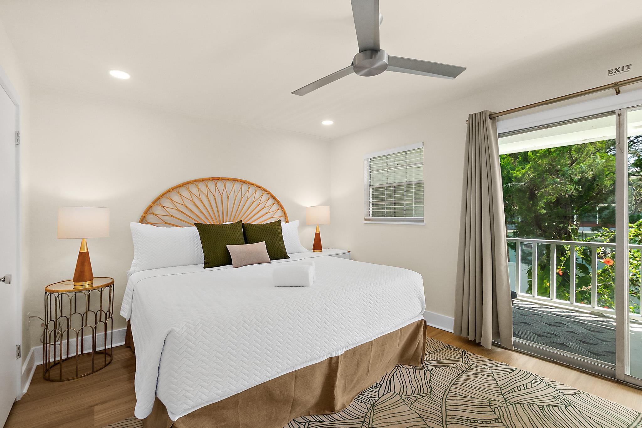 405 Flagler Boulevard, Unit 8A St. Augustine, FL 32080 - Photo 16 of 35 a bedroom with a large bed and a large window