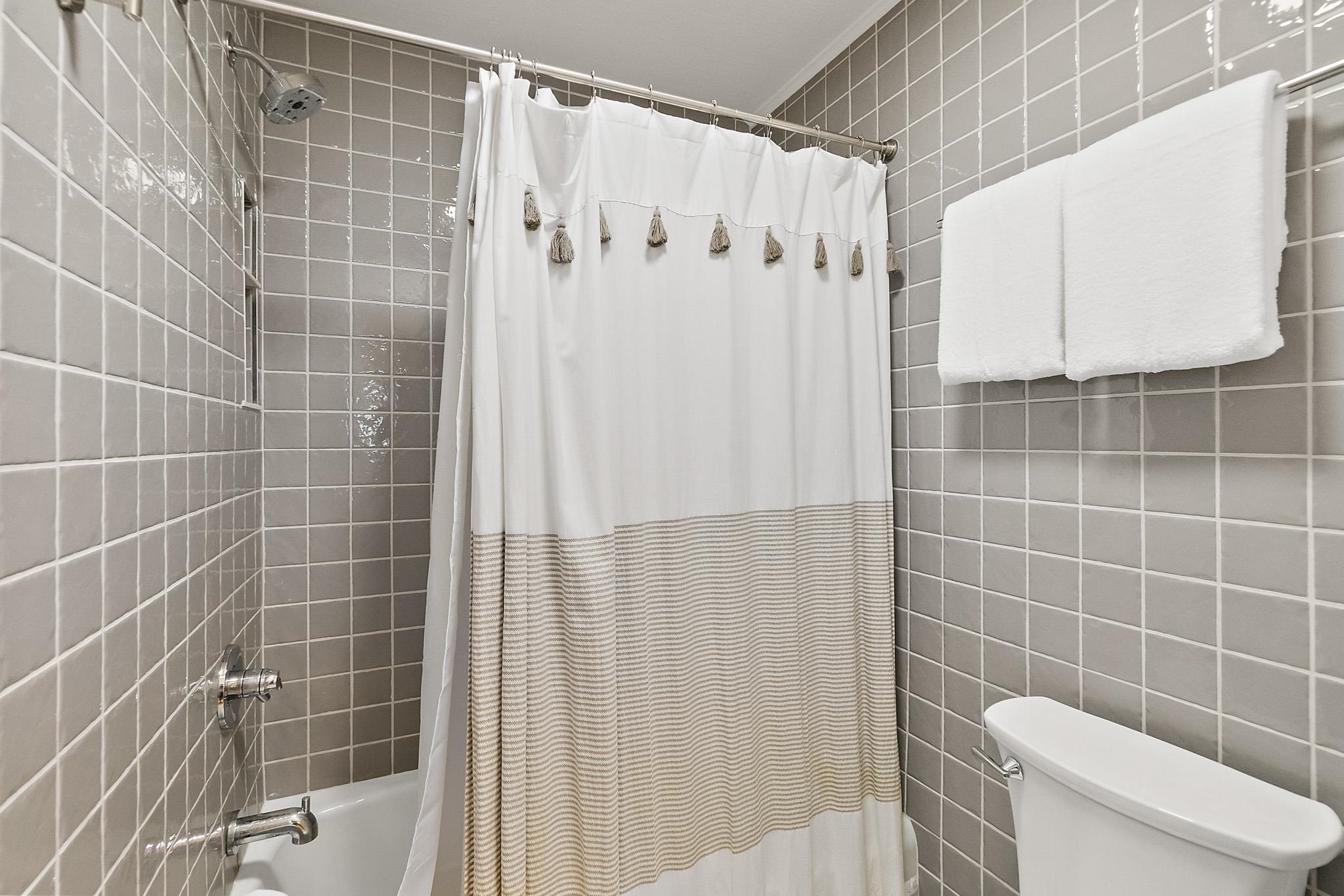 405 Flagler Boulevard, Unit 8A St. Augustine, FL 32080 - Photo 21 of 35 a bathroom with a shower and a toilet
