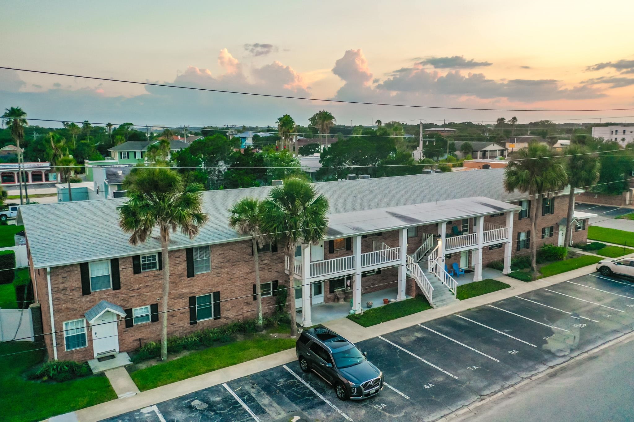 405 Flagler Boulevard, Unit 8A St. Augustine, FL 32080 - Photo 30 of 35 aerial view of a house with a yard and potted plants