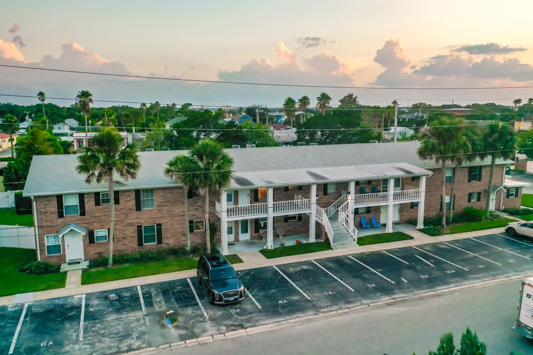 405 Flagler Boulevard, Unit 8A St. Augustine, FL 32080 - Photo 31 of 35 front view of a house with a yard