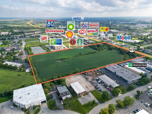 a view of a back yard of the house with a street