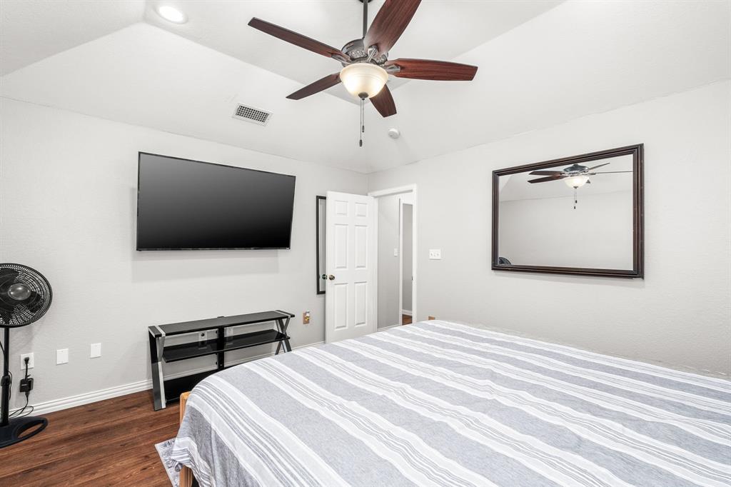 1401 Hickory Drive Pilot Point, TX 76258 - Photo 13 of 34 Spacious room featuring wood-finish flooring, light grey walls, and a recessed ceiling with a ceiling fan