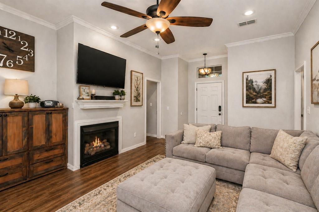 1401 Hickory Drive Pilot Point, TX 76258 - Photo 2 of 34 Living area featuring wood-finish flooring, a ceiling fan with light fixture, recessed lighting, and a fireplace with mantle