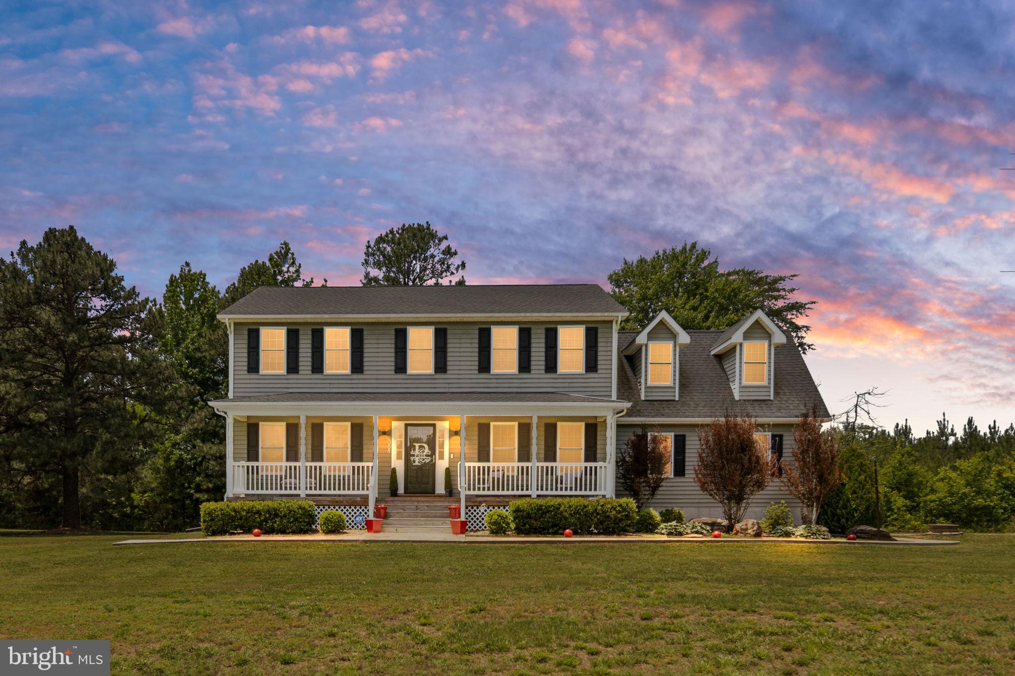 Charming home under a vibrant sky.