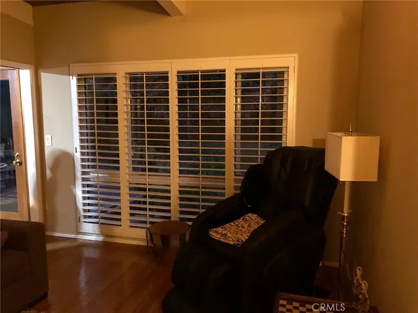 a front view of a house with a large window