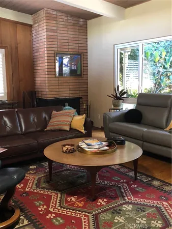 a living room with furniture and window