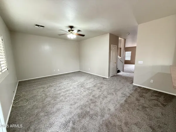 a view of a big room with carpet