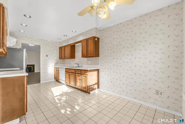 a bathroom with a sink a mirror and a shower