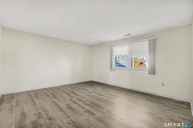 an empty room with a bench