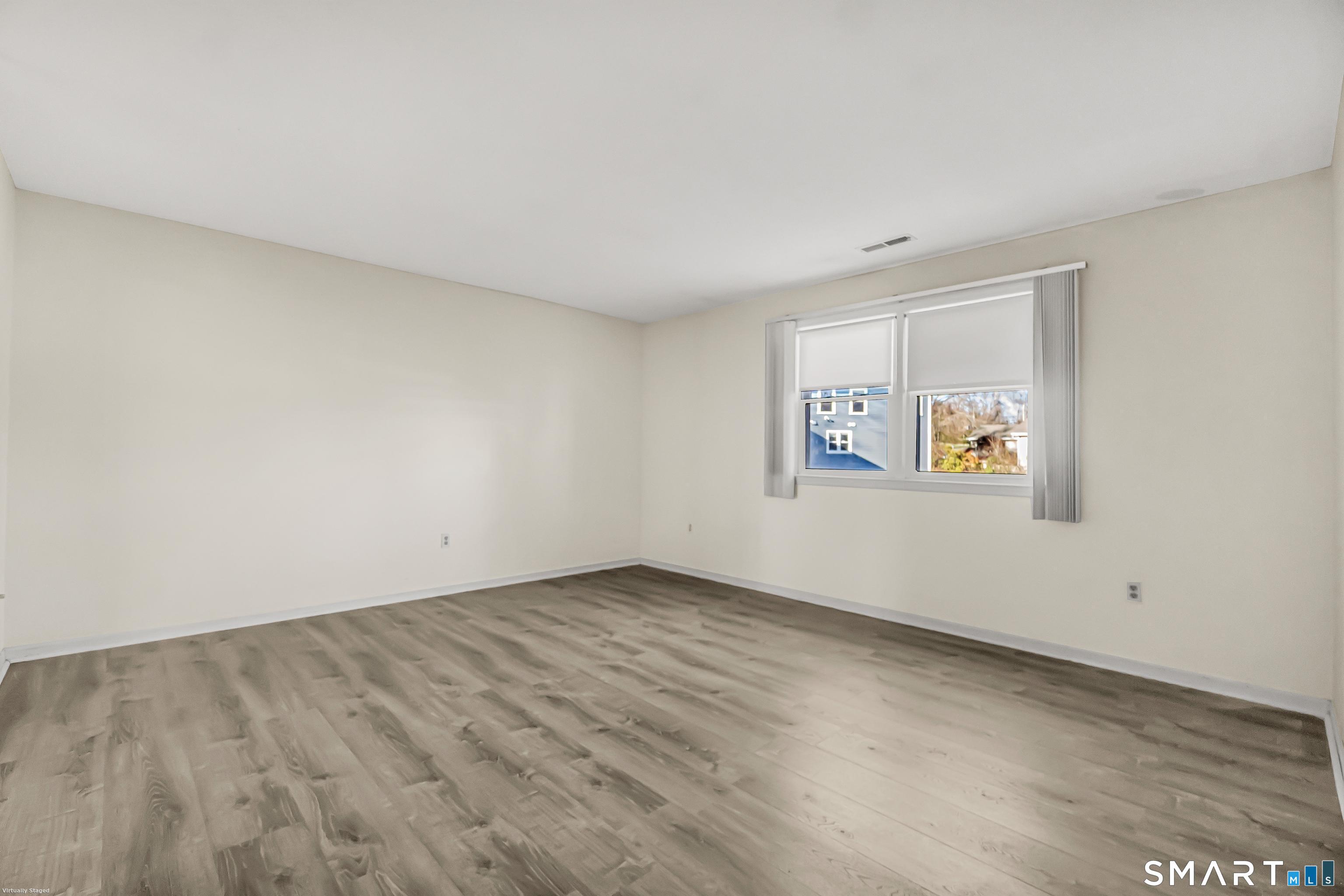 4023 Park Avenue, Unit 4023 Fairfield, CT 06825 - Photo 23 of 25 an empty room with a bench