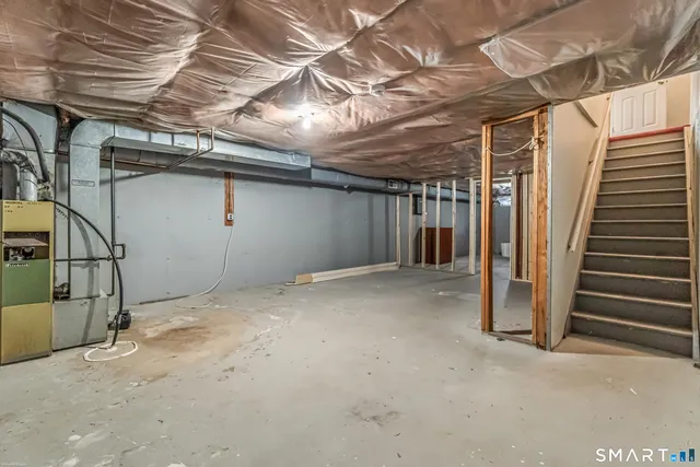 a view of empty room with stairs