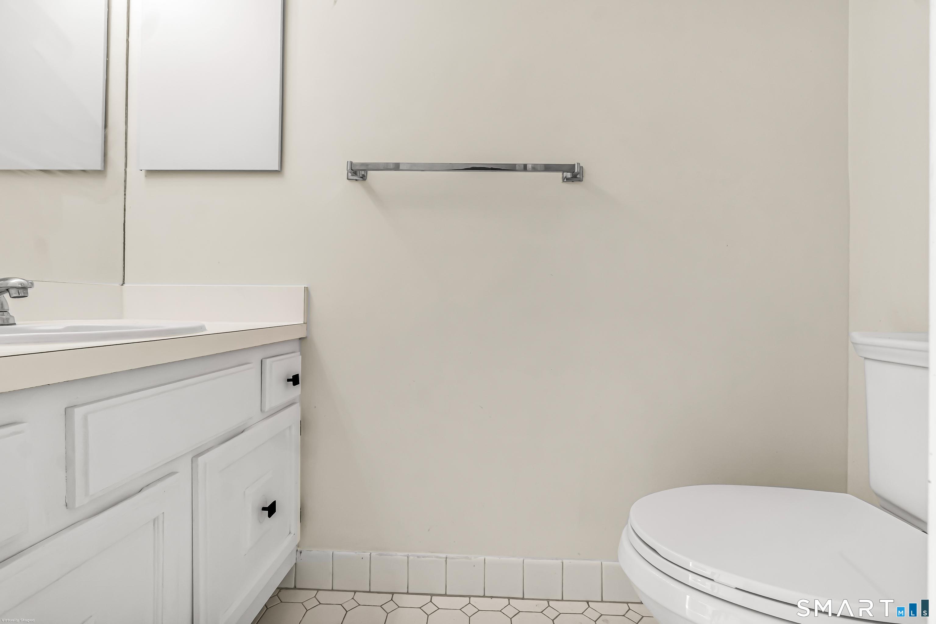 4023 Park Avenue, Unit 4023 Fairfield, CT 06825 - Photo 6 of 25 a bathroom with a sink a toilet and mirror