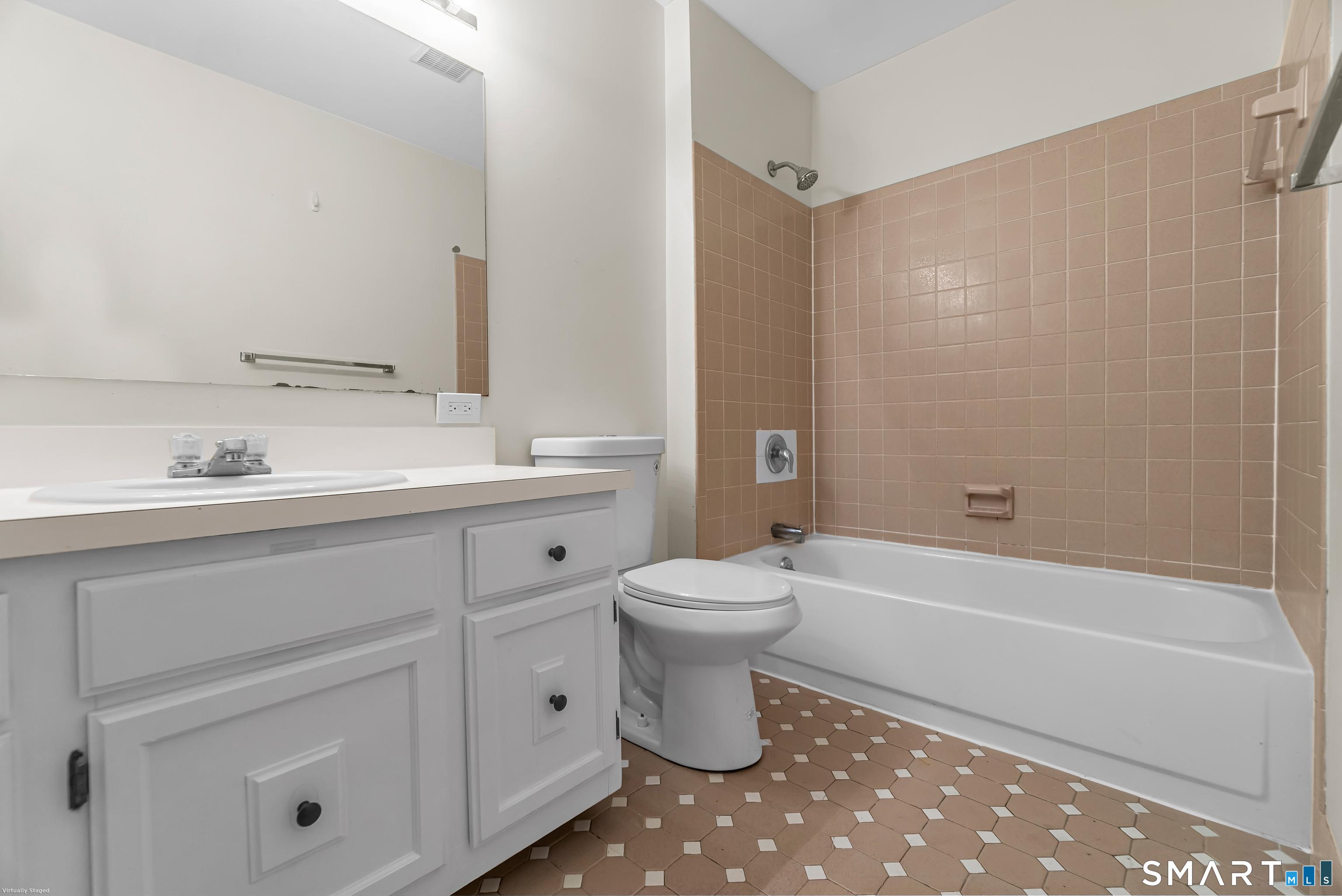 4023 Park Avenue, Unit 4023 Fairfield, CT 06825 - Photo 8 of 25 a bathroom with a sink a toilet and a bathtub