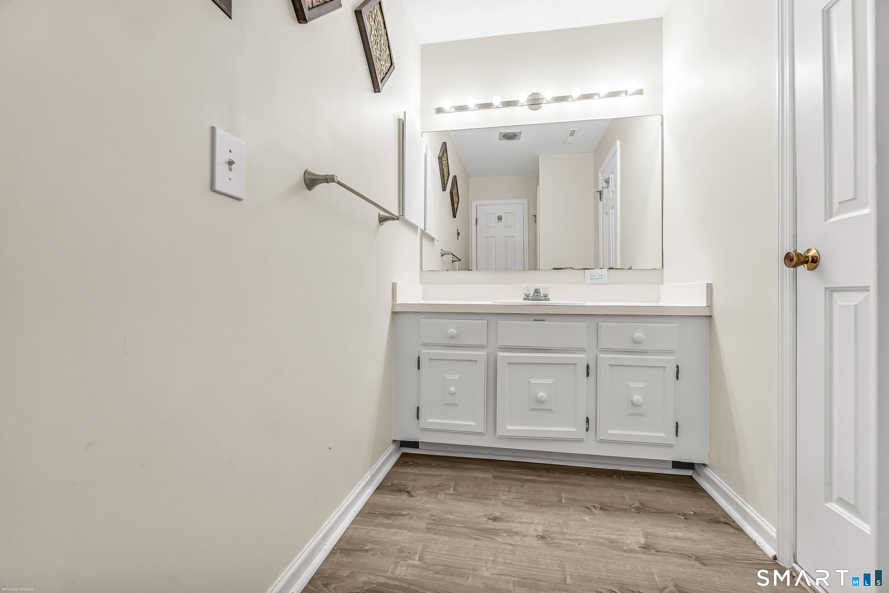 4023 Park Avenue, Unit 4023 Fairfield, CT 06825 - Photo 10 of 25 a view of a sink and a mirror