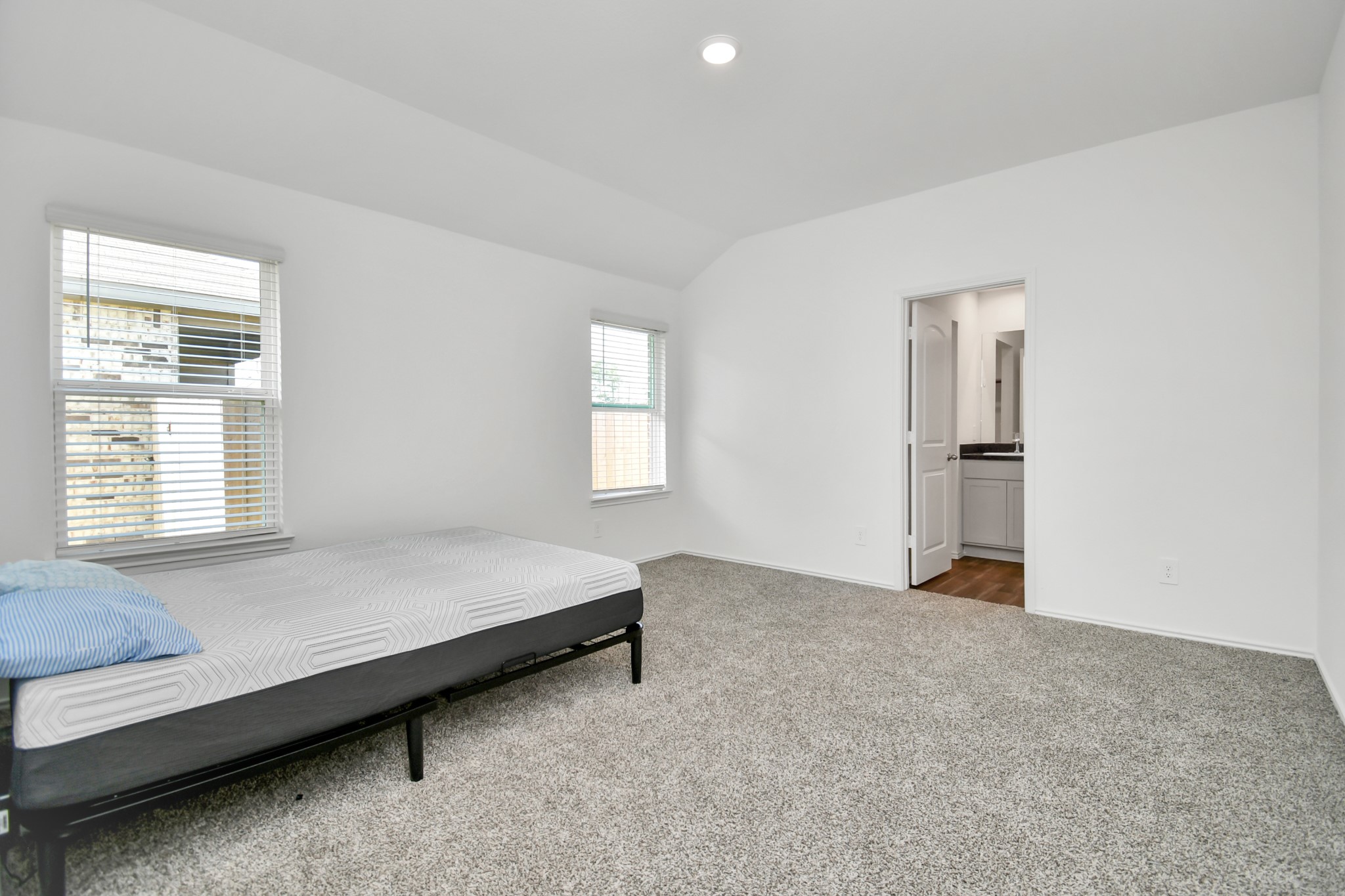 5315 Castlebury Meadows Dr Spring Spring, TX 77373 - Photo 27 of 39 a spacious bedroom with a bed and a window