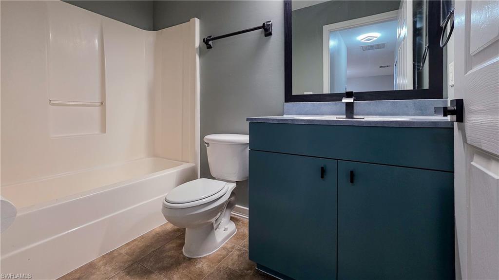 7319 Albany Road Fort Myers, FL 33967 - Photo 19 of 27 a bathroom with a sink toilet and shower