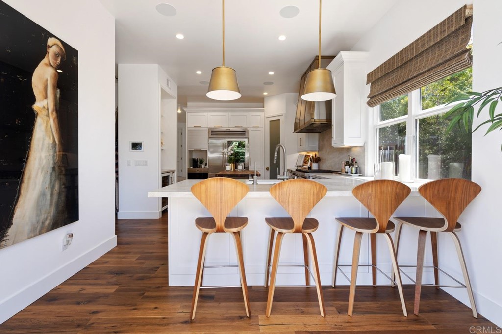 1068 Devonshire Drive Encinitas, CA 92024 - Photo 25 of 44 a view of a dining room with furniture window and wooden floor
