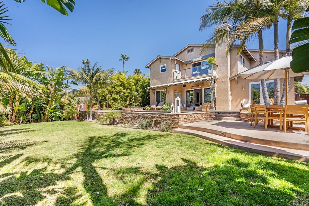 1068 Devonshire Drive Encinitas, CA 92024 - Photo 27 of 44 a swimming pool with outdoor seating and yard