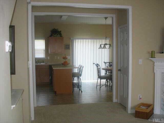 2224 Persimmon Ridge Drive Raleigh, NC 27604 - Photo 10 of 10 a dining room with furniture and a window
