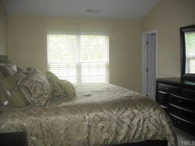 2224 Persimmon Ridge Drive Raleigh, NC 27604 - Photo 5 of 10 a bedroom with a bed and a window