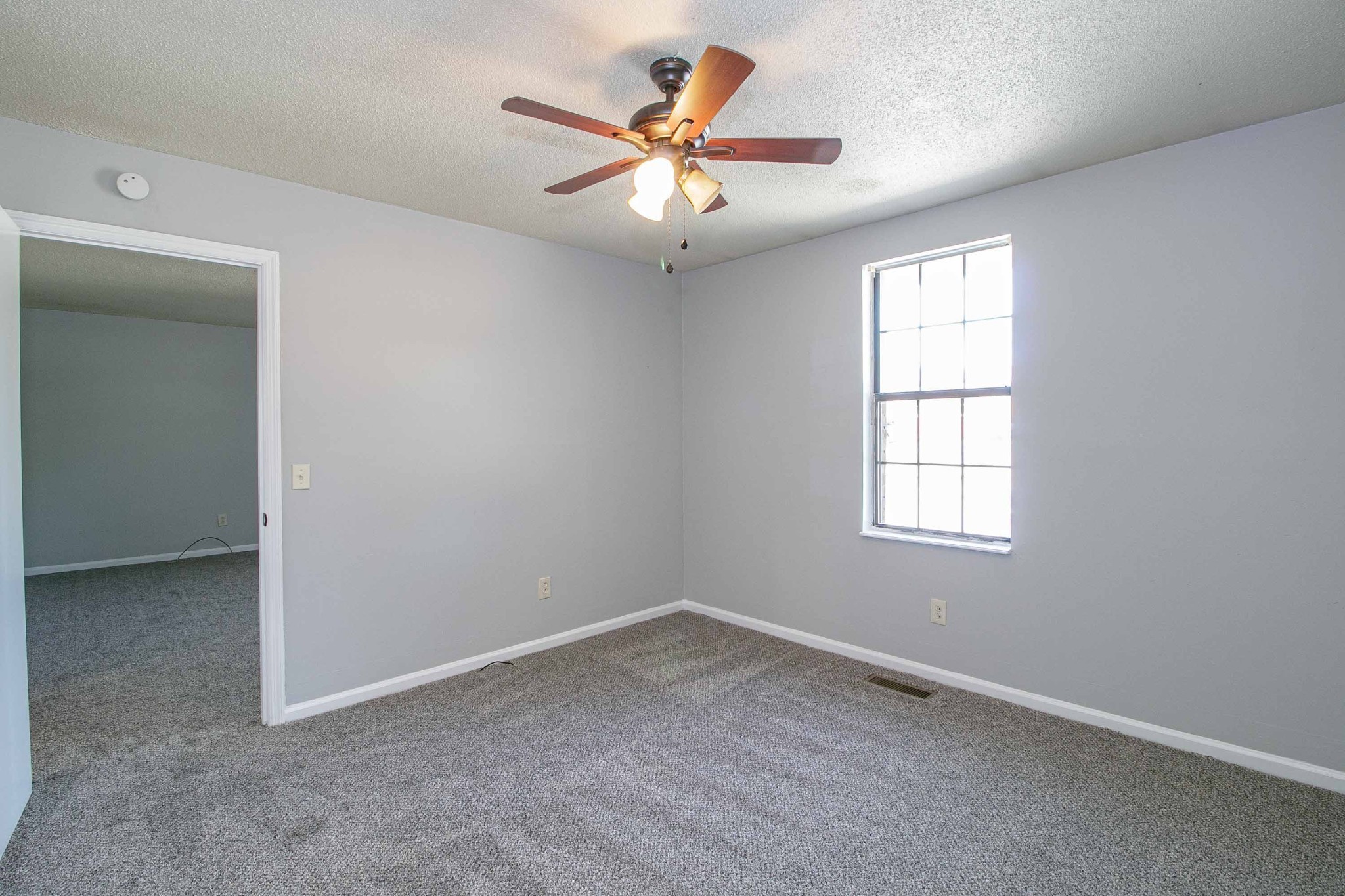 1100 Mcdaniel Road Clarksville, TN 37043 - Photo 37 of 71 an empty room with window and ceiling fan