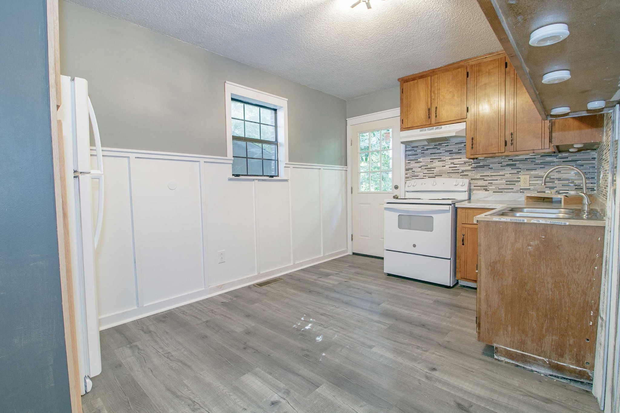 1100 Mcdaniel Road Clarksville, TN 37043 - Photo 51 of 71 a view of a kitchen with a sink wooden cabinets and stainless steel appliances
