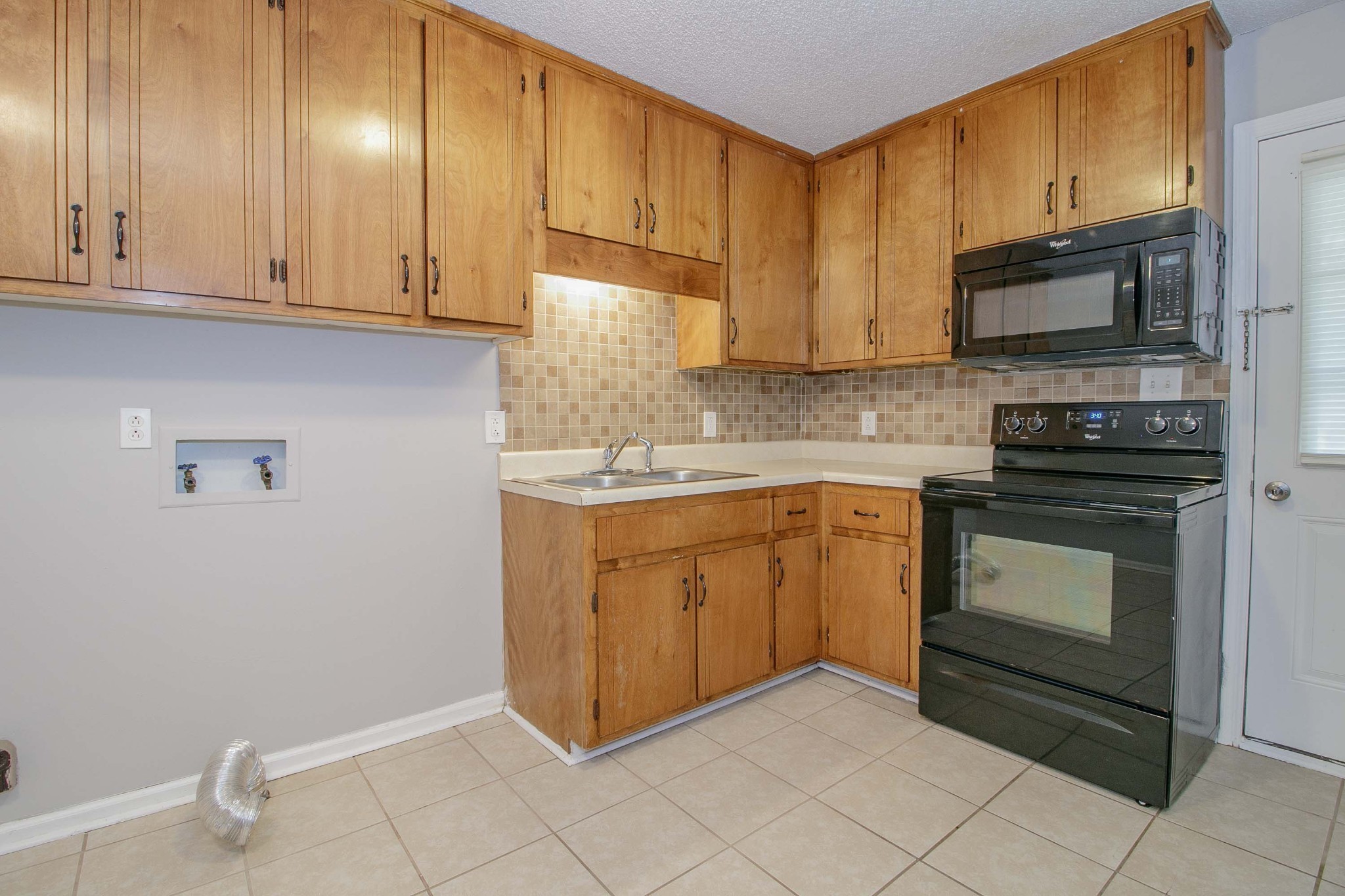 1100 Mcdaniel Road Clarksville, TN 37043 - Photo 70 of 71 a kitchen with granite countertop cabinets stainless steel appliances and a sink