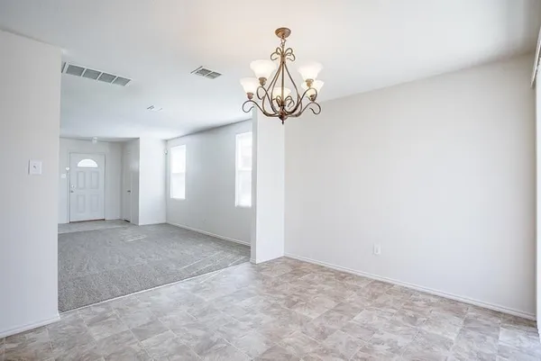 a view of a chandelier fan in a room