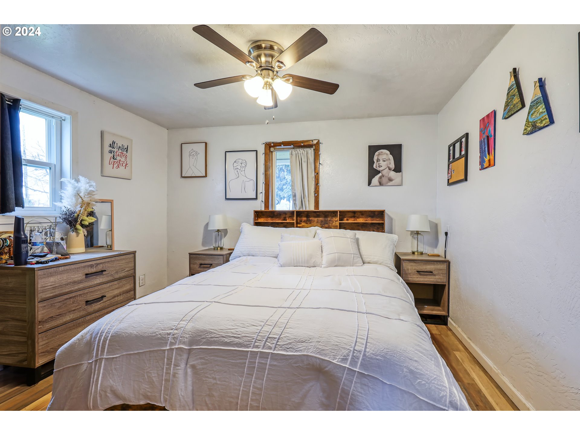 615 48th Street Springfield, OR 97478 - Photo 11 of 16 a bedroom with a large bed and a chandelier
