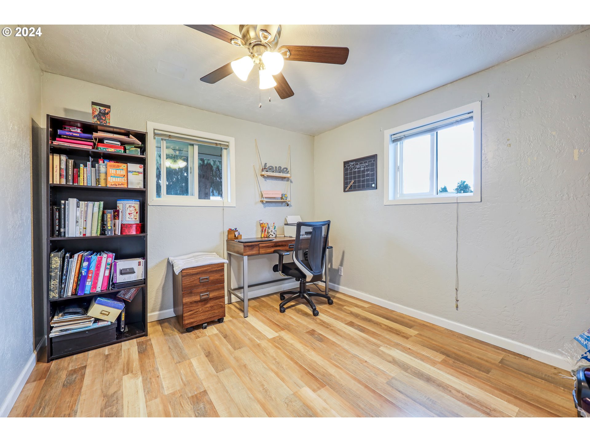 615 48th Street Springfield, OR 97478 - Photo 13 of 16 a workspace with a bookshelf