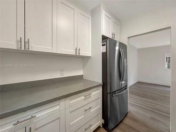 a kitchen with appliances and cabinets