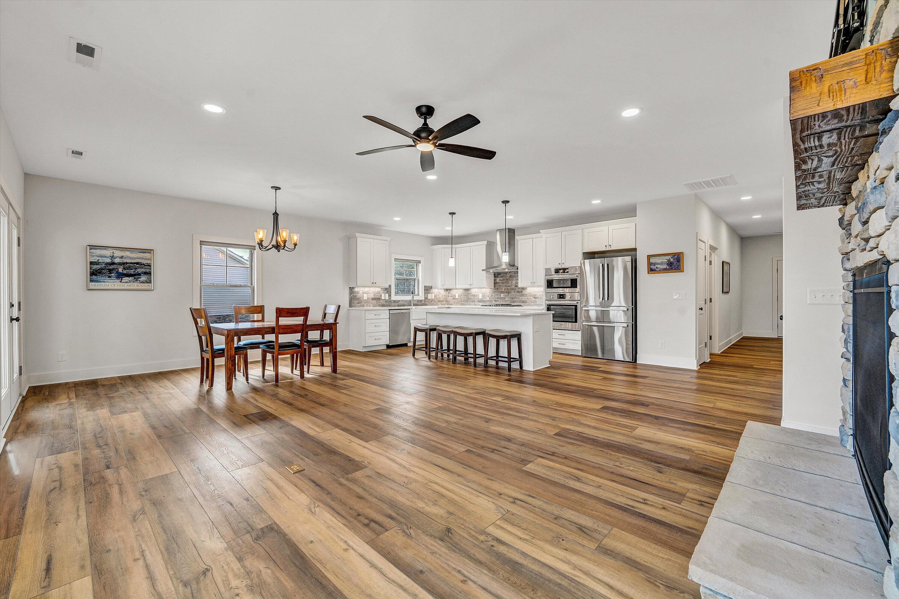 17 Alpine Drive Union Hall, VA 24176 - Photo 16 of 35 a living room with furniture wooden floor and a kitchen view