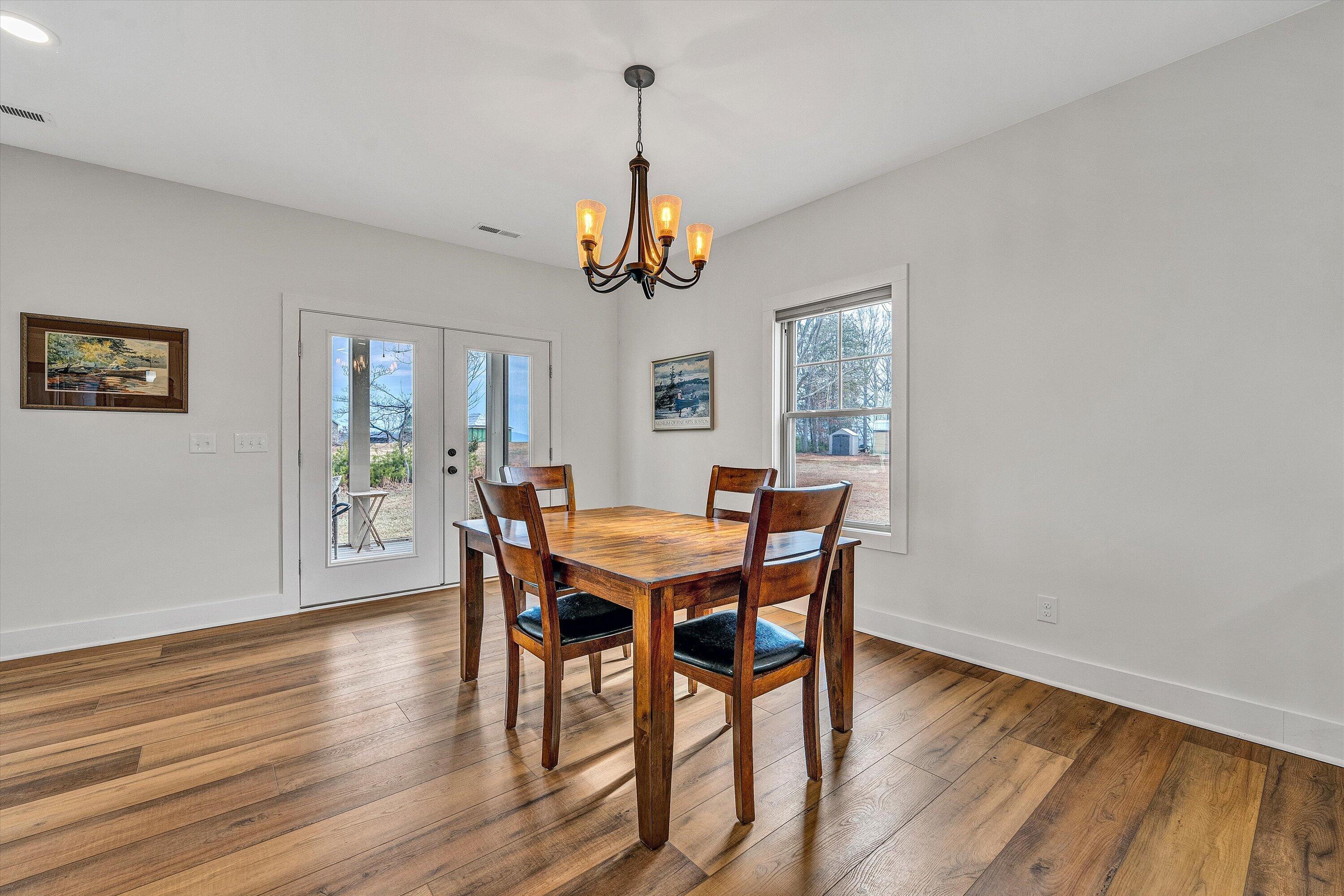 17 Alpine Drive Union Hall, VA 24176 - Photo 17 of 35 a view of a dining room with furniture window and wooden floor